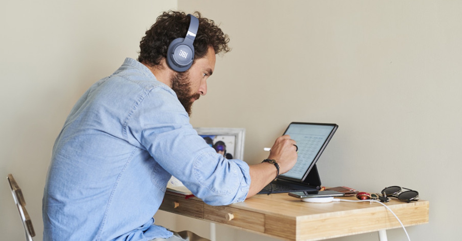 Bearded Freelancer Browsing Data On Tablet Bearded Freelancer Browsing Data On Tablet